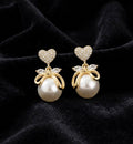 THE COQUETTE CHARM |  PEARL AND PAVE HEART BOW EARRINGS