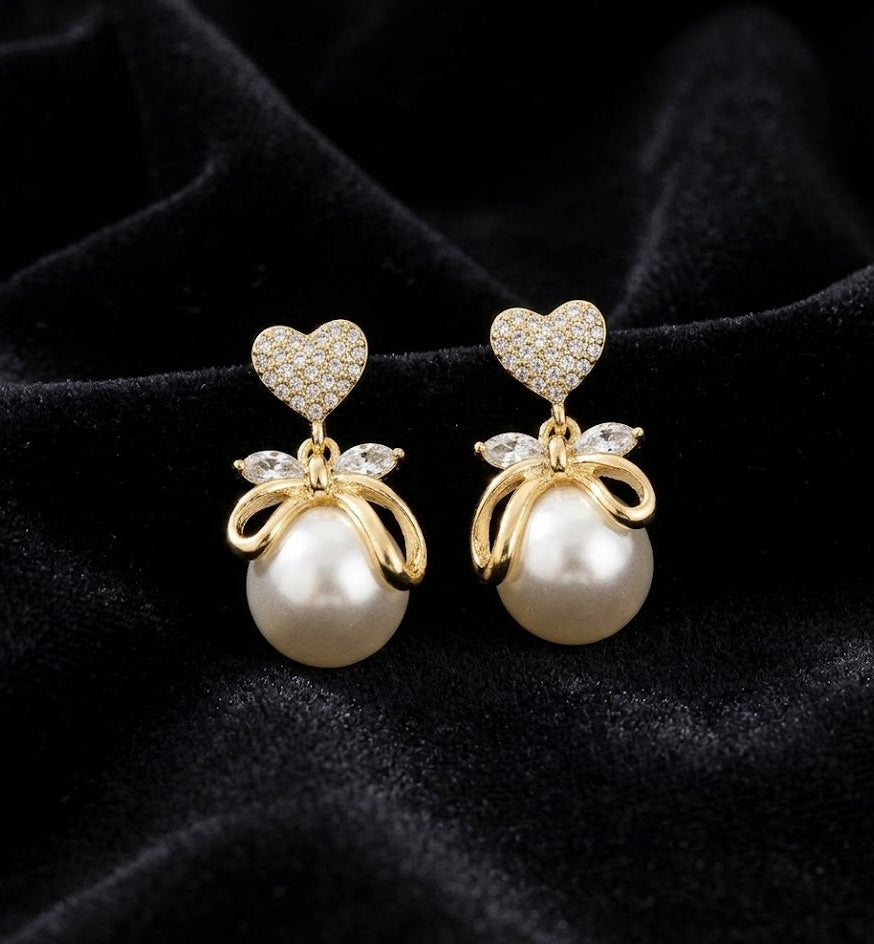 THE COQUETTE CHARM |  PEARL AND PAVE HEART BOW EARRINGS